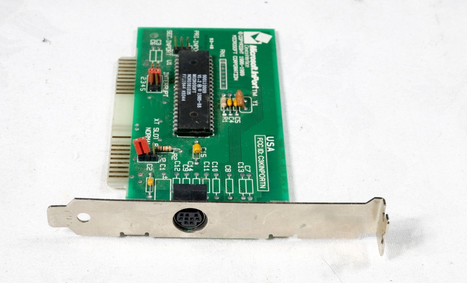 The connector side of the bus mouse InPort ISA card with Mini-DIN-9 connector