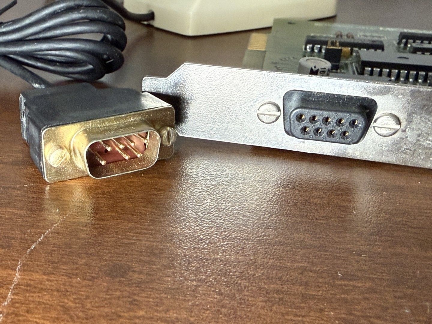 The connector side of the Microsoft bus mouse ISA card, and the plug from a bus mouse