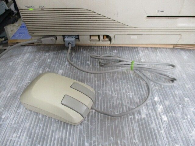 An NEC PC-98 mouse plugged into a PC-98